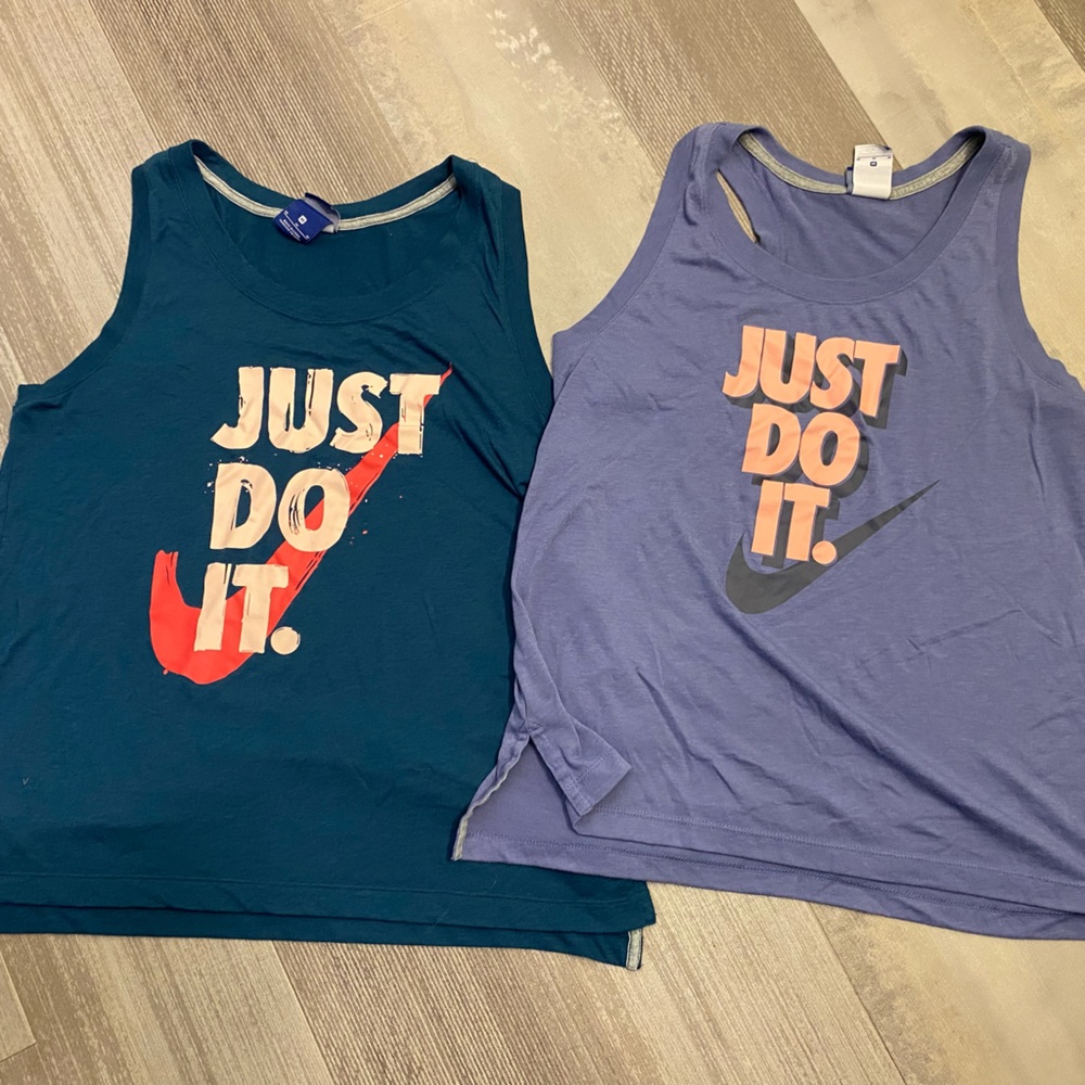 Two Nike workout tank tops